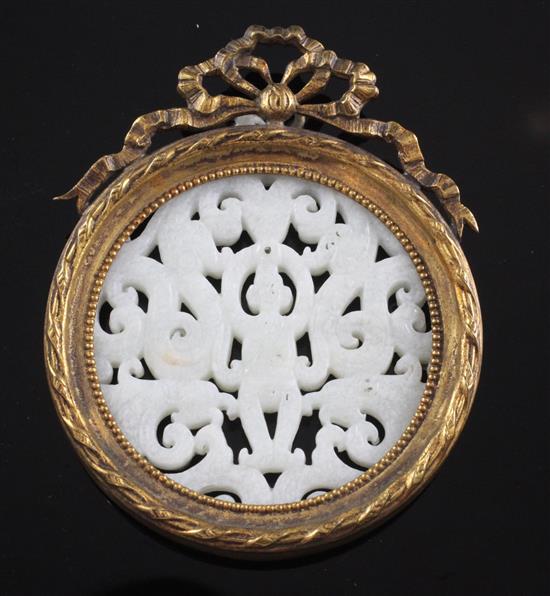 A Chinese white hardstone plaque, diam. 7.6cm